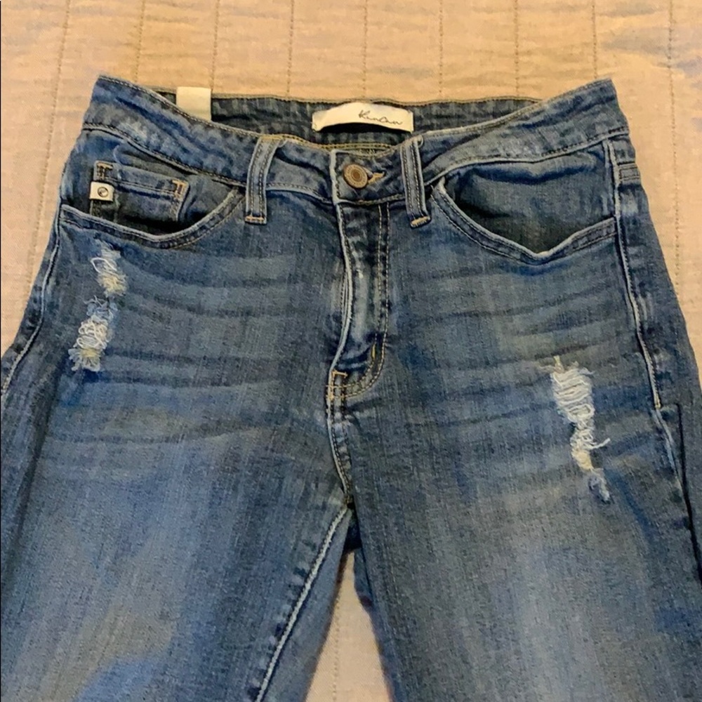 Distressed blue jeans